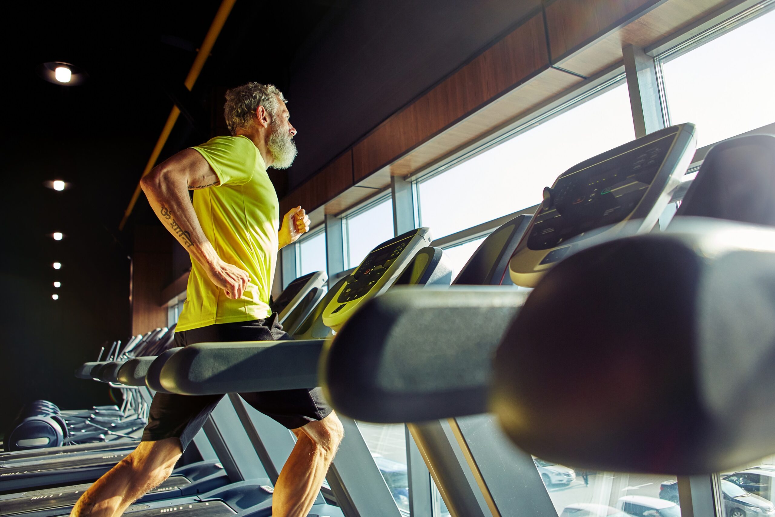 Side,View,Of,A,Athletic,Middle,Aged,Man,In,Sportswear