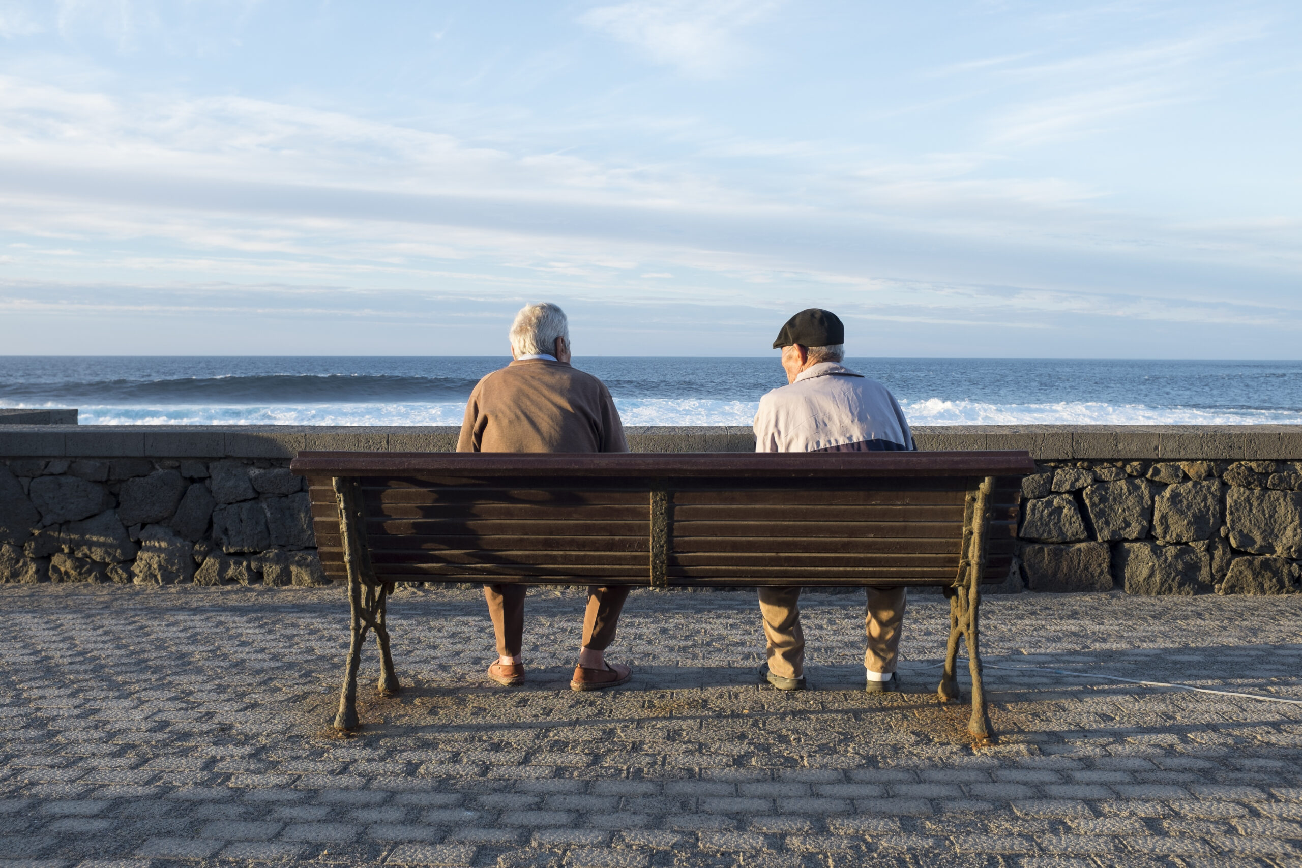 old people looking the sea